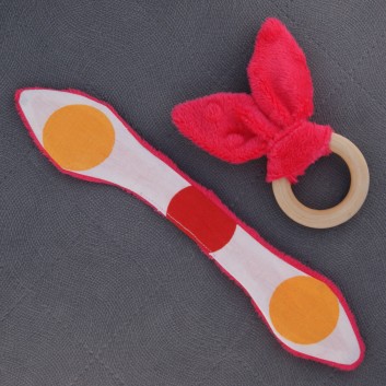 Teether – bunny ears - raspberry / colourful big spots on white background